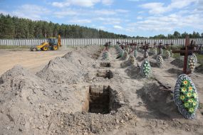 Burial of unidentified bodies of people who died and died during the occupation at the city cemetery in Bucha