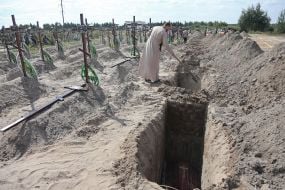 Burial of unidentified bodies of people who died and died during the occupation at the city cemetery in Bucha