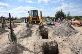 Burial of unidentified bodies of people who died and died during the occupation at the city cemetery in Bucha