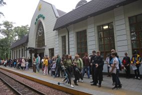 People on the platform near the station of the "Kyiv Passenger Children's" station of the Kyiv Children's Railway