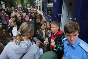 Passengers near the train at the Kyiv Children's Passenger Railway station