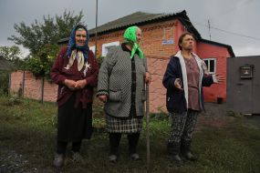 Local residents of the de-occupied village of Grakove in the Kharkiv region