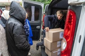 Volunteers distribute humanitarian aid to local residents in the liberated city of Balakliya