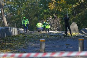 Representatives of the KMDA study the condition of the pedestrian and bicycle bridge and the area near it after the rocket attacks by the Russian occupiers in Kyiv