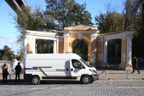 Investigative actions of the police near the yellow amphitheater with a white colonnade after rocket fire by the Russian invaders in Kyiv