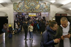 People are waiting for the air alarm at the subway station