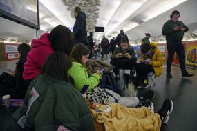 People are waiting for the air alarm at the subway station
