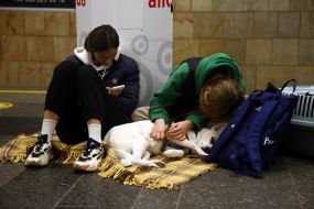 People are waiting for the air alarm at the subway station