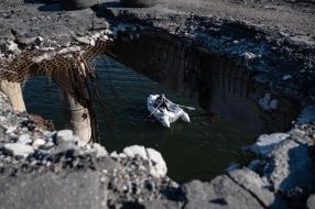 The destroyed bridge across the Siverskyi Donets river