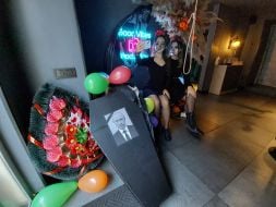 A coffin with a portrait of Putin