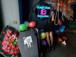 A coffin with a portrait of Putin