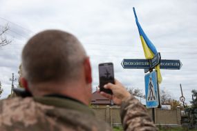 Flag of Ukraine on a road sign in  Vysokopolye village