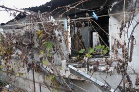 Destroyed residential building in  Vysokopolye village
