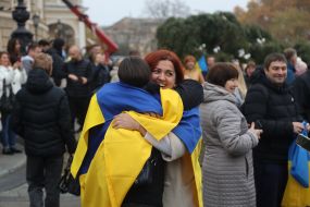 Residents of Kherson, who evacuated to Odessa, celebrate the liberation of their native city near the Opera House