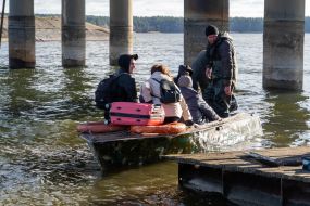 Boat crossing through the Pechenezh reservoir in Stary Saltov village