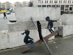 Graffiti by the British street artist Banksy on Maidan Nezalezhnosti in Kyiv