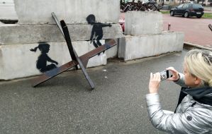 Graffiti by the British street artist Banksy on Maidan Nezalezhnosti in Kyiv