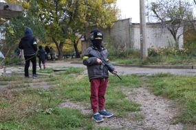 A boy with a toy weapon in de-occupied Kherson