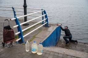 People draw water from the Dnipro in de-occupied Kherson