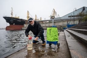 People draw water from the Dnipro in de-occupied Kherson