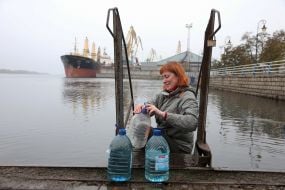 People draw water from the Dnipro in de-occupied Kherson
