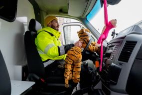 Volunteer driving a special ambulance for resuscitation of newborns