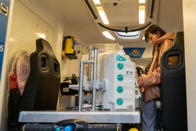 Neonatologist checks equipment operation in special ambulance for resuscitation of newborns