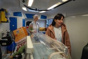 Neonatologist checks equipment operation in special ambulance for resuscitation of newborns