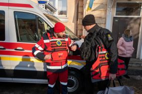 Ambulance worker trying on a lightweight body armor