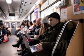 People are waiting for the air alarm at the subway station