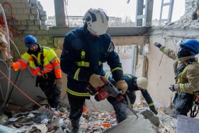 Rescuers are sorting through the debris in the destroyed apartment building