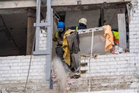 Rescuers are sorting through the debris in the destroyed apartment building