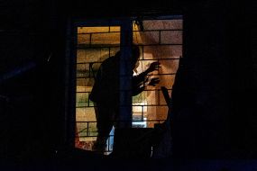Rescuers in one of the apartments of the house damaged by the explosion