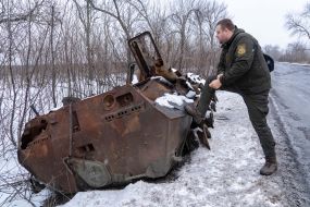 Destroyed armored personnel carrier on the road in the Kharkov region