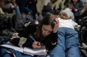 Teachers and students conduct lessons in the subway during a rocket attack