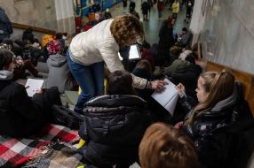 Teachers and students conduct lessons in the subway during a rocket attack
