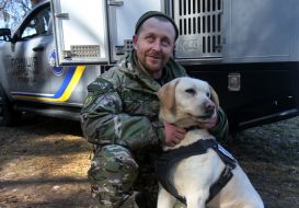 Dog breeder with a dog