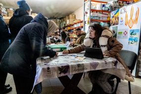 Local residents receive humanitarian aid in the village of Tsirkuny, Kharkiv region