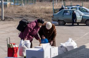 Local residents receive humanitarian aid in the village of Tsirkuny, Kharkiv region
