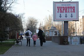 A billboard with a pointer to a place to hide in Kherson