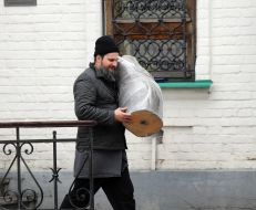 A man carries things on the territory of the Kiev-Pechersk Lavra