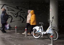 A bicycle covered in snow