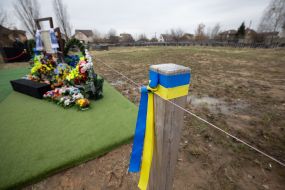 A memorial cross at the burial place of Buchi civilians killed by the Russian occupiers,