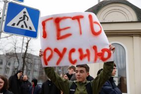 Young man with a poster