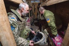 Chaplain at the positions of his military unit