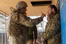 Chaplain at the positions of his military unit