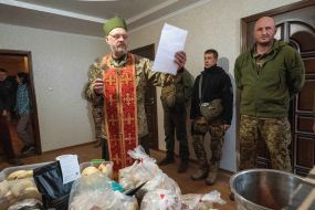 Military chaplain conducts the ceremony of consecration of Easter cakes