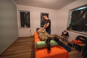 A rehabilitation doctor conducts a manual therapy session for a serviceman of the 113th brigade