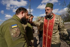 The chaplain held a memorial service for the soldiers of his military unit