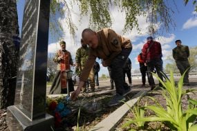 Servicemen of the 113th brigade lay flowers at the monument at the site of the death of their comrades